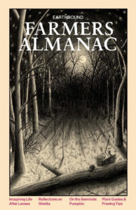 Cover of the 2022 "The Earthbound Farmers Almanac" featuring a snowy night view through trees with a moon in the background
