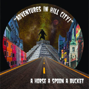 Image description: Cover of A Horse A Spoon A Bucket's Adventures in Hill City album, depicting digital collage of a paved road bordered by buildings of various architectural styles & leading to a Mesoamerican pyramid with a giant bear standing on its hind legs on top. In the sky overhead is a full moon.