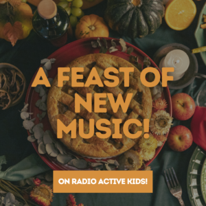 Image description: photograph of a table full of food, including a pie, pumpkins, & apples. Overlaid on top of the photo are the words "A feast of new music!" in orange & in an orange box below that are the words "On Radio Active Kids!"
